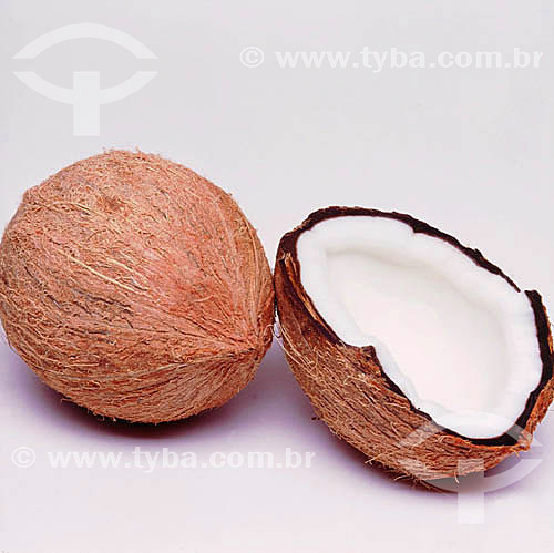  Whole and sliced coconut, showing its white 