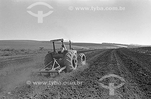  Agriculture - Farm equipment - Tractor working the land for seeding 