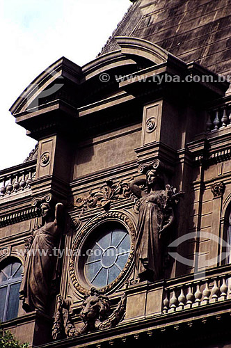  Architectural detail of two women sculpted in stone in the roman-style on the facade of the 