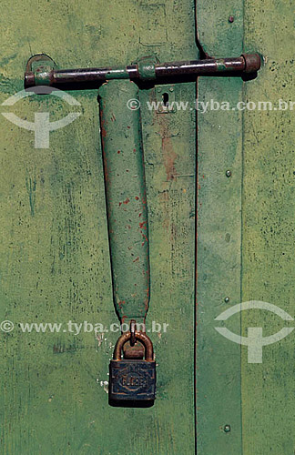  Detail of an old door bar with padlock - Laranjeiras city - Sergipe state - Brazil 