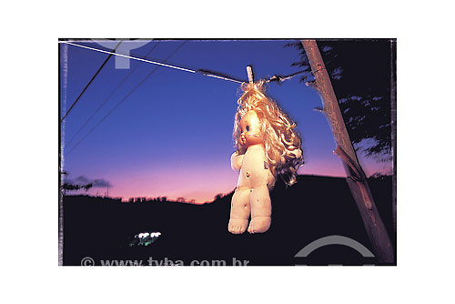  Doll hanged during sunset 