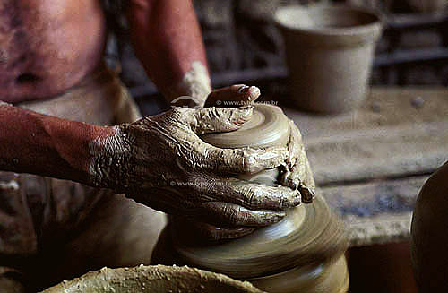  Manual ceramics manufacture - Craftsman starting to sculpture a vase - Pernambuco state - Brazil 