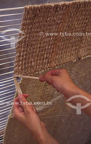  Craftwork -  Detail of hands doing sisal tapestry made with the fiber of the plant Agave sizalan  - Brazil