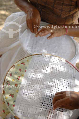  Woman hands doing an embroidery table cloth - Ferro Island - Sao Francisco River  - Pao de Acucar city - Brazil
