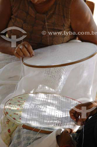  Woman hands doing  an embroidery table cloth - Ferro Island - Sao Francisco River  - Pao de Acucar city - Brazil