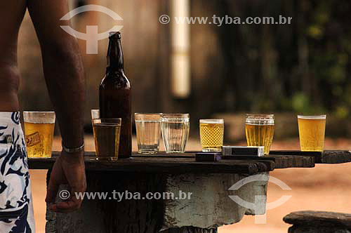  cups, beer and cigarette on a bar table - Sambaetiba district - Itaboraí city - RJ state - Brazil - january, 2007 