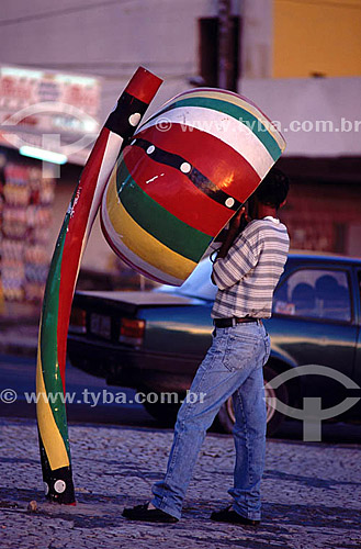  Telecommunication - man talking on a public telephone designed as a 