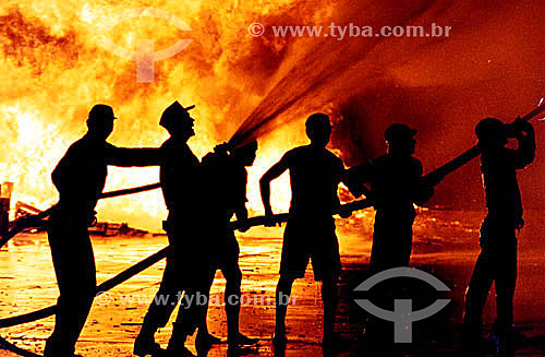  Fire - Silhouette of firemen with fire in the background - Brazil 
