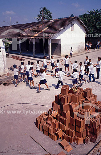  Students playing in the middle of a building  construction at a little public school - Brazil  - Brazil
