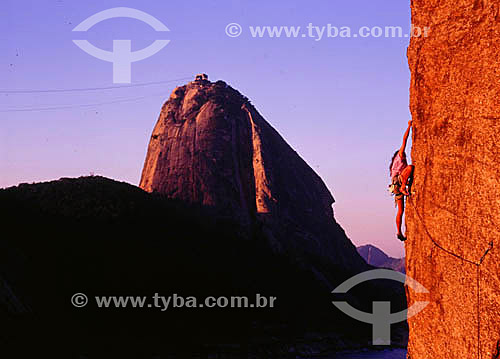  Climbing with Sugar Loaf* in the background -  Rio de Janeiro city - Rio de Janeiro state - Brazil  * Commonly called Sugar Loaf Mountain, the entire rock formation also includes Urca Mountain and Sugar Loaf itself (the taller of the two). This whol 