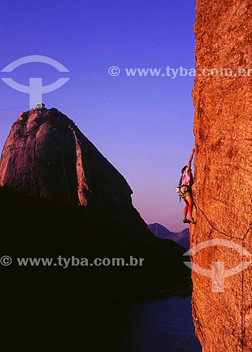  Climbing with Sugar Loaf* in the background -  Rio de Janeiro city - Rio de Janeiro state - Brazil  * Commonly called Sugar Loaf Mountain, the entire rock formation also includes Urca Mountain and Sugar Loaf itself (the taller of the two). This whol 