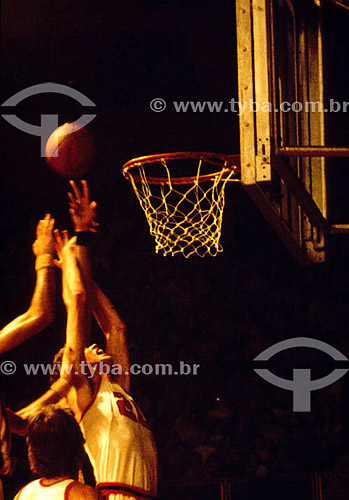  Basketball - players trying to throw the ball on basket 