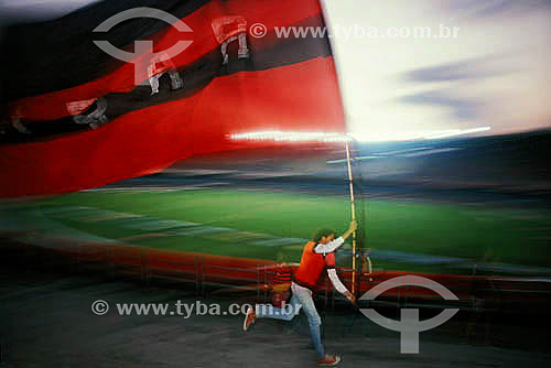  Soccer game - fan running with the Flamengo Football Club flag - Maracana Stadium - Rio de Janeiro city - Rio de Janeiro state - Brazil  - Rio de Janeiro city - Rio de Janeiro state (RJ) - Brazil