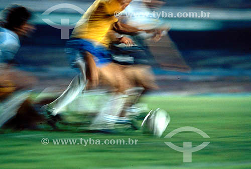  Soccer game - Brazilian Soccer Team: detail of the the players kicking the ball 