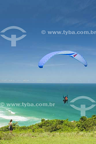 People practicing Parachuting at Praia Mole beach  - Florianopolis city - Santa Catarina state - Brazil 