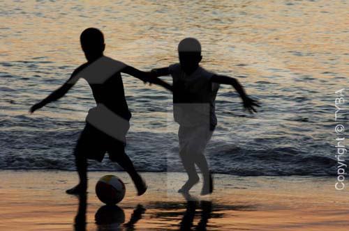  Silhouette of boys playing football at the beach - Guaratiba Beach, at the south  coast of the state of Rio de Janeiro, near the Restinga da Marambaia (Marambaia Coastal Plain) - Rio de Janeiro city - Rio de Janeiro state - Brazil 