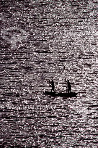  Silhouette of two fishermen on a 