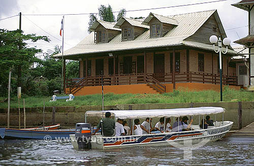  Boat with tourists in the Oiapoque River in front of Saint Georges city - national border (French França/Guiana - Brazil) - Amapa state - Brazil 