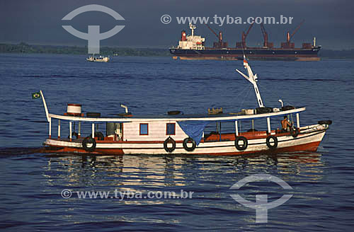  Regional boats and a cargo ship on the Rio Negro (Black River), near the city of Manaus - Amazonas state - Brazil 