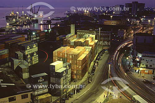  The cargo terminal and the historic Alfandega (Customs) building (built by the British) at the port of Manaus city* on the banks of the Rio Negro (Black River), with the movement of cars passing by on the street in the foreground and a cargo ship in 