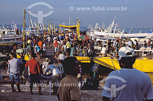  People at the harbor of Manaus city* - Amazonas state - Brazil - october/2003  *The architectural joint of the harbor is a National Historic Landmark since 14-10-1987. 