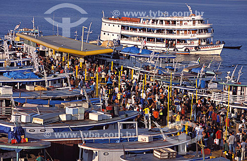  People at the harbor of Manaus city* - Amazonas state - Brazil - october/2003  *The architectural joint of the harbor is a National Historic Landmark since 14-10-1987. 