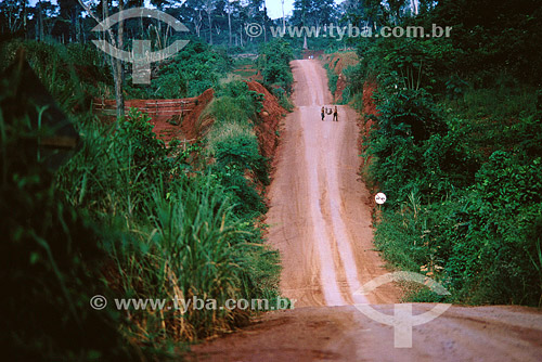  Trans-Amazonian highway, with two settlers of the area with a hunt in the shoulder - Amazonian - Brazil 