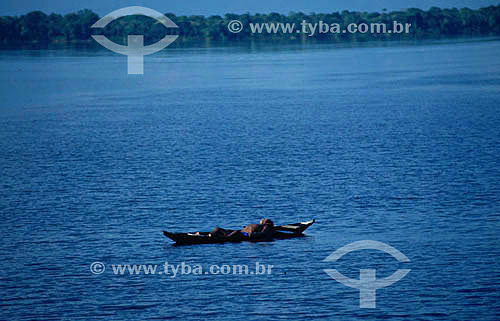  Boy sleeping in the canoe - Rio Negro (Black River) - Amazonas state - Brazil 