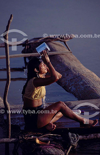  Woman taking a bath on Rio Negro (Black River) - Amazonas state - Brazil 