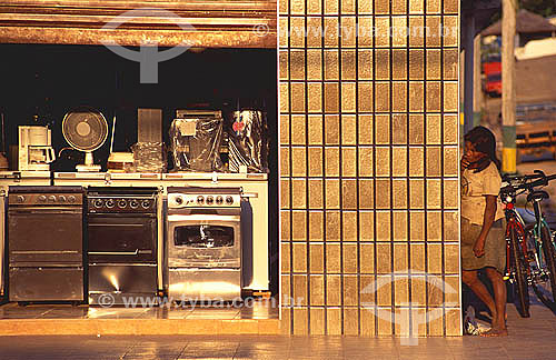  Amazonian Inhabitants - Woman observing a store of appliances in Sao Gabriel da Cachoeira village - Amazonas state - Brazil 