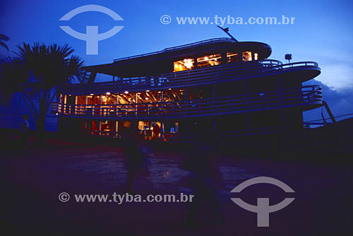  A style of boat typical to Amazonian region for people`s transport illuminated at sunset - Amazonas state - Brazil 