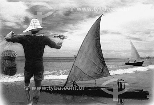  Fisherman with hat and rustic basket going to the sea, a 