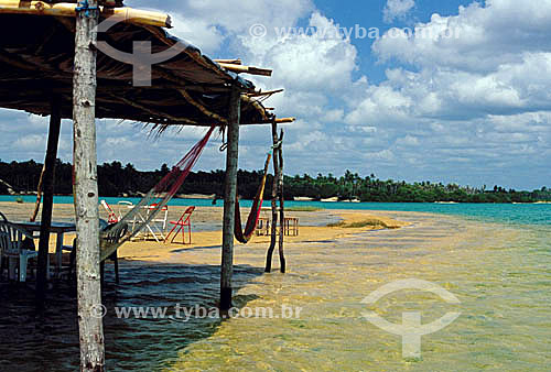  A hut with hammocks and tables on a sandbar in Lagoa da Tatajuba (Tatajuba Lagoon) - Jericoacoara - Ceara state - Brazil 