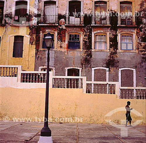  Boy walking and light post - Sao Luis city* - Maranhao State - Brazil  *The city is World Heritage for UNESCO since 12-04-1997 and the architectural and town planning group of the city is National Historic Site since 03-13-1974. 