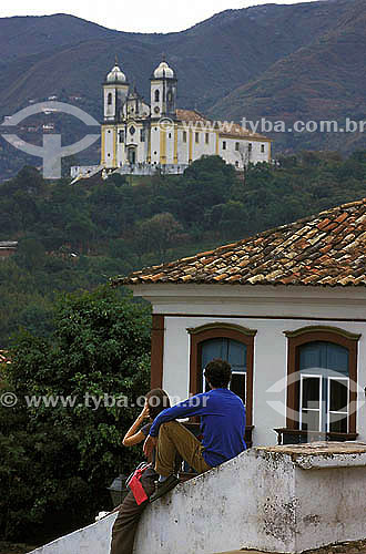  Tourist couple looking church - Ouro Preto (*) city - Minas Gerais state - Brazil  *Ouro Preto city is a UNESCO World Heritage Site in Brazil since 05-09-1980. 