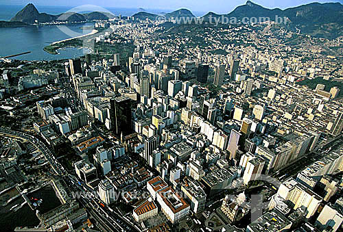  Aerial view of t Rio de Janeiro city downtown - the buildings in the foreground, and the  Marina da Gloria and the Sugar Loaf in the left on the background - Rio de Janeiro state - Brazil 