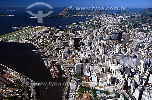  Aerial view of Rio de Janeiro city downtown, showing the Sao Bento Monastery, the Port with the ships, and the Santos Dumont airport (at the left) and the Sugar Loaf Mountain in the background - RJ - Brasil 