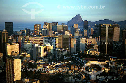  Aerial view of Rio de Janeiro city downtown, showing buildings in the foreground and the Sugar Loaf Mountain(2) in the backround - Rio de Janeiro city - Rio de Janeiro state - Brazil  (2) Commonly called Sugar Loaf Mountain, the entire rock formatio 