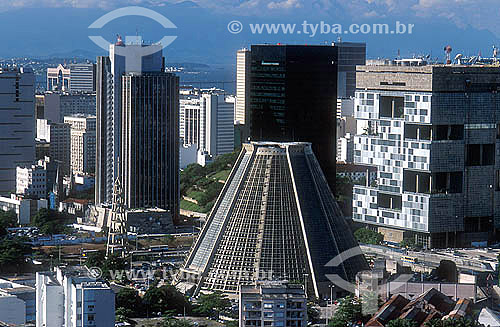  View of Rio de Janeiro city downtown, showing the conical São Sebastião do Rio de Janeiro`s Cathedral (or Metropolitan Cathedral), the Petrobras Building (in cubes behind the cathedral) and the BNDES building. Rio de Janeiro city - Rio de Janeiro st 