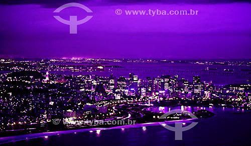  Aerial view of the Aterro do Flamengo* at twilight  with the illuminated buildings from the center of Rio de Janeiro city and the Rio-Niteroi Bridge in the background - Rio de Janeiro state - Brazil 