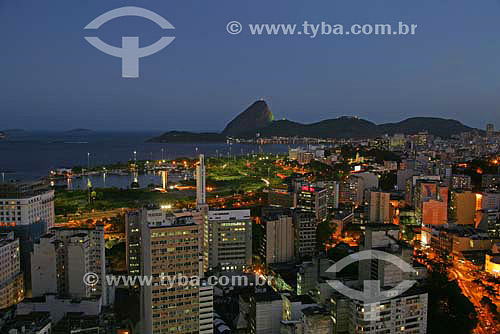  View of Rio de Janeiro city downtown at sunset, showing buildings in the foreground and the Sugar Loaf Mountain in the background - Rio de Janeiro city - Rio de Janeiro state - Brazil  