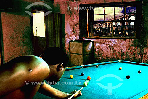  Scenes of the urban life - Man playing snooker by night at the bohemian neighbourhood of Lapa with the  