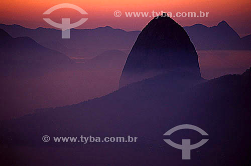  Detail of Sugar Loaf Mountain´s silhouette* at dawn - Rio de Janeiro city - Rio de Janeiro state - Brazil  *Commonly called Sugar Loaf Mountain, the entire rock formation also includes Urca Mountain and Sugar Loaf itself (the taller of the two). Thi 