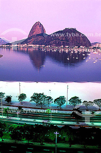  The Sugar Loaf Mountain* as seen from Botafogo Beach at twilight - Rio de Janeiro city - Rio de Janeiro state - Brazil  *Commonly called Sugar Loaf Mountain, the entire rock formation also includes Urca Mountain and Sugar Loaf itself (the taller of  