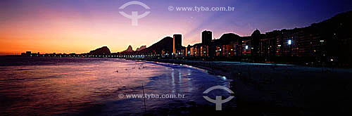  Panoramic view of Copacabana Beach at sunset with Morro dos Dois Irmaos (Two Brothers Mountain) and Rock of Gavea in the background to the left - Rio de Janeiro city - Rio de Janeiro state - Brazil 