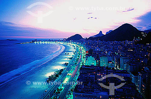  Aerial view of Copacabana Beach at sunset with Morro dos Dois Irmaos (Two Brothers Mountain) and Rock of Gavea in the background to the left - Rio de Janeiro city - Rio de Janeiro state - Brazil 