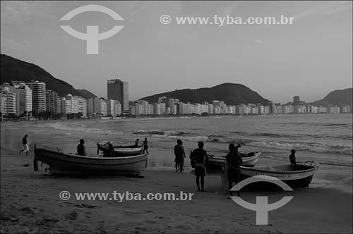  Copacabana Beach with Fishing boats and fishermen in the foreground and buildings in the background - Rio de Janeiro city - Rio de Janeiro state - Brazil - October 2006 