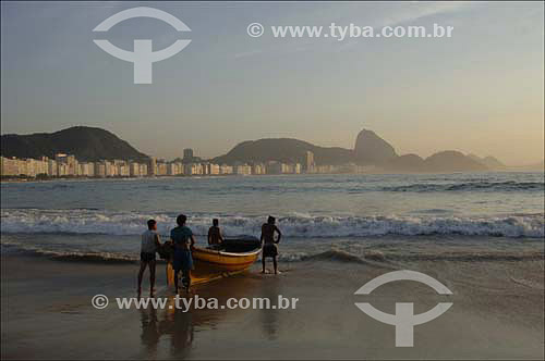  Copacabana Beach with Fishing boats and fishermen in the foreground and Suggar Loaf* in the background - Rio de Janeiro city - Rio de Janeiro state - Brazil - October 2006  *Commonly called Sugar Loaf Mountain, the entire rock formation also include 