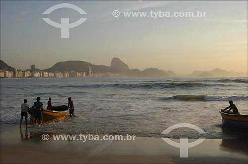  Copacabana Beach with Fishing boats and fishermen in the foreground and Suggar Loaf* in the background - Rio de Janeiro city - Rio de Janeiro state - Brazil - October 2006  *Commonly called Sugar Loaf Mountain, the entire rock formation also include 