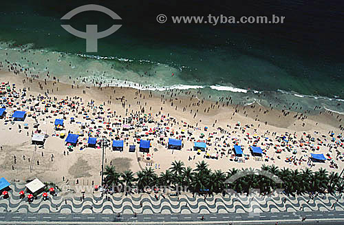  Aerial view of people on Copacabana Beach with part of the Copacabana Promenade (*) and bicycle path at the very bottom of the photo - Rio de Janeiro city - Rio de Janeiro state - Brazil  (*) Avenida Atlantica (Atlantic Avenue) was inaugurated in 19 